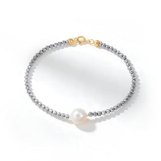 Bracciale in Ematite Grigia con Perla Bianca Centrale Gancio in Oro 18kt